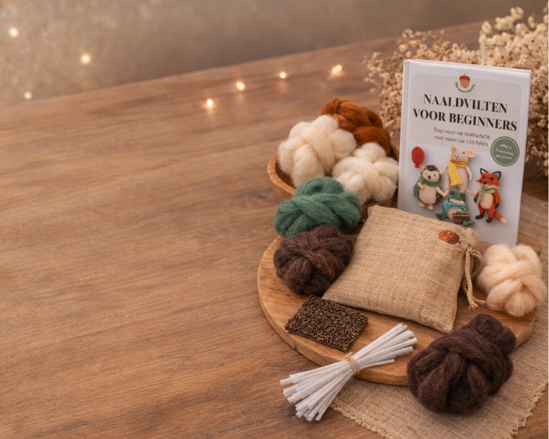 Wooden table with craft materials and a book against a blurred decorative background.