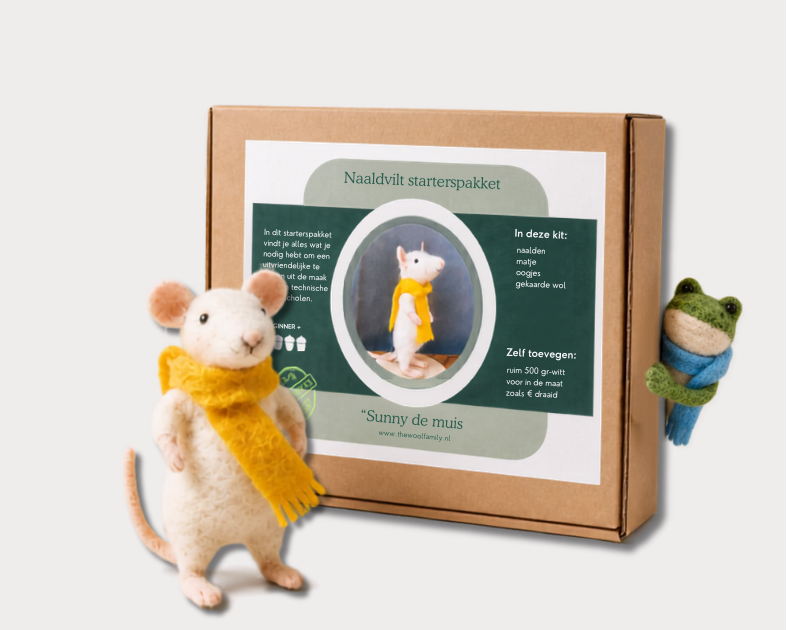 needle felted mouse  with a yellow scarf next to a cardboard box with text and graphics on a white background